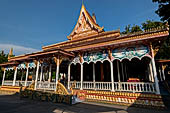 Vientiane, Laos - Pha That Luang, among the Other structures on the ground there is an open sala decorated with brightly colored paintings.  